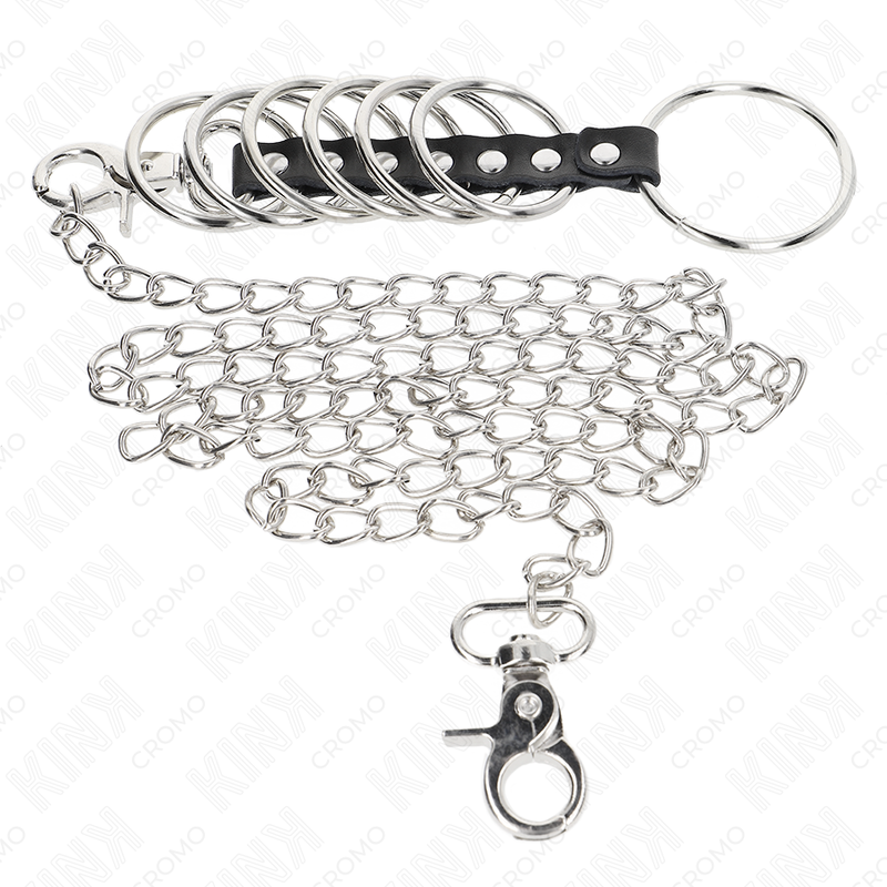 KINK - 7 ANELLI PENIENE IN METALLO DA 3,8 CM A 5 CM COLLEGATI CON PELLE E UNA CATENA IN METALLO DA 100 CM